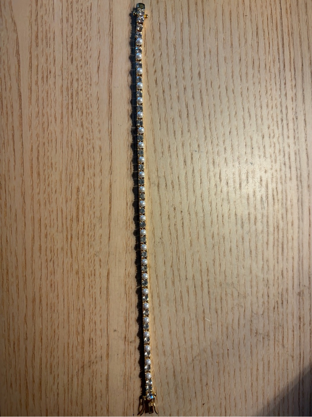 Gold tone tennis bracelet